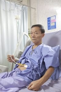 Man receiving feeding through stomach tube.