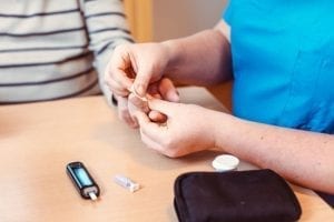 Providing Information and training on how to check blood sugar at home so that the caregiver can monitor a diabetic's insulin needs and adjust their dietary intake and activity level accordingly is important to maintaining the health of family members.